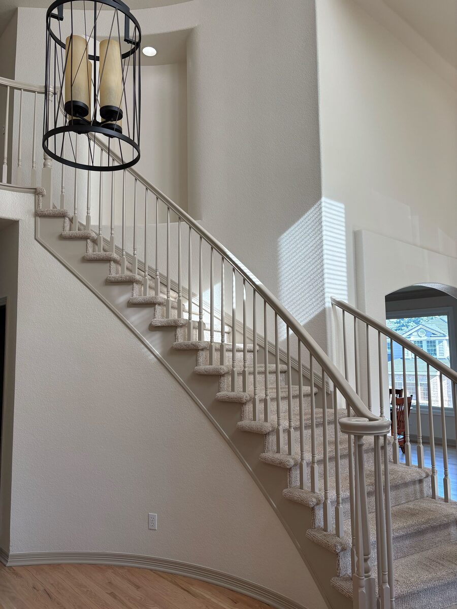 Freshly painted stairwell by Kind Home Painting