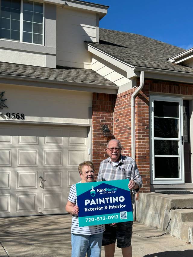 Margaret Wright in front of her newly painted home