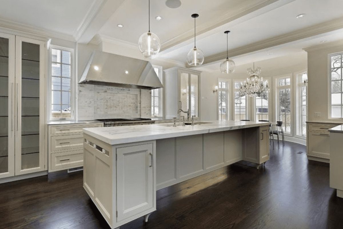 Bright white repainted kitchen with large island