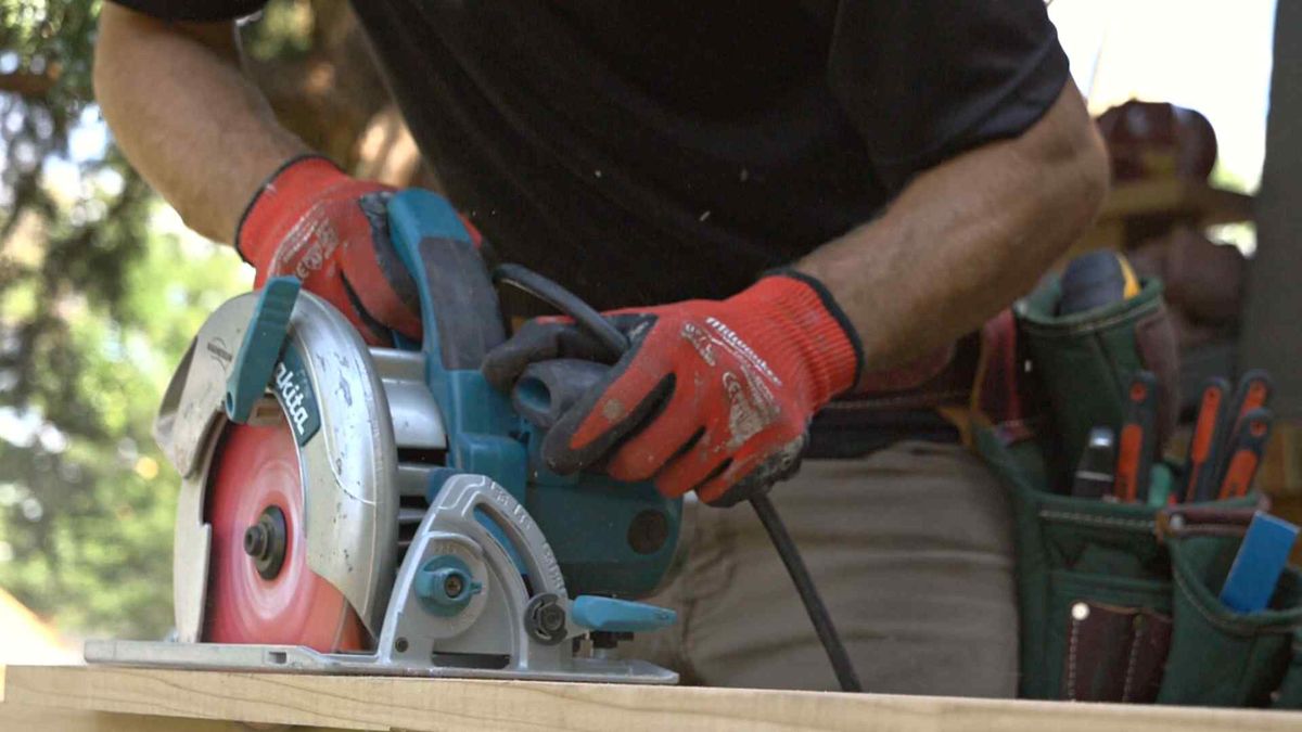 A Kind Home carpenter cutting replacement boards on site